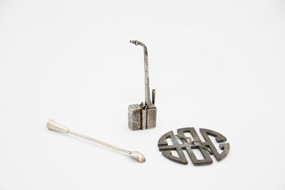 Lot 334 - A Chinese white metal opium pipe, signed, circa 1900.