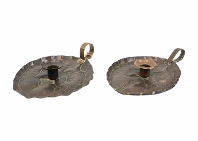 Lot 8 - A pair of Arts & Crafts copper chamber sticks or candle holders