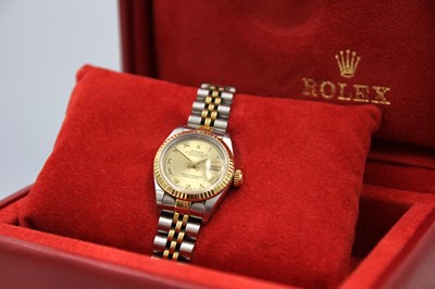 Lot 132 - ROLEX - A Rolex Oyster Perpetual Datejust lady's gold and stainless steel bracelet wristwatch.