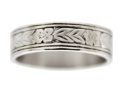 Lot 171 - An attractive platinum foliate engraved lady's band ring.