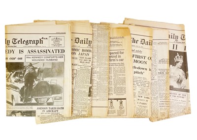 Lot 411 - Mid-century newspapers with world-changing headlines