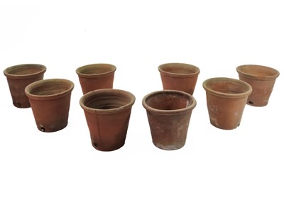 Lot 527 - A collection of eight terracotta flower pots.