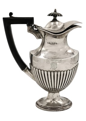 Lot 19 - An Edwardian half fluted pedestal hot water jug by W G Keight & Co.