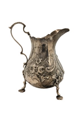 Lot 22 - A Victorian silver cream jug by Robert Harper.