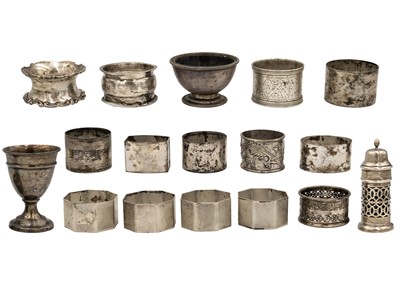 Lot 68 - A quantity of silver napkin rings, two salts and an egg cup.