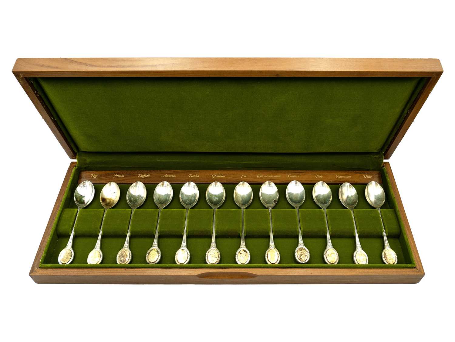 Lot 43 - A cased set of twelve silver royal horticultural society flower spoons.