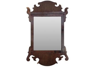 Lot 134 - A 19th century walnut fretwork mirror.