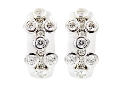 Lot 221 - Hans D. Krieger - A stunning pair of 18ct white gold diamond set earrings.