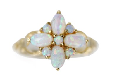 Lot 223 - A 9ct opal set nine-stone ring.