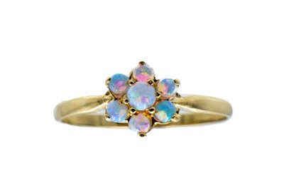 Lot 240 - A 9ct opal set daisy ring.