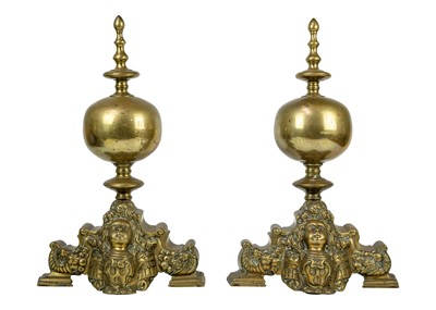 Lot 1017 - A pair of Dutch brass andirons.