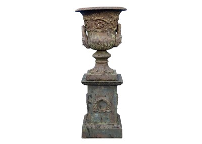 Lot 526 - A classical style cast iron garden urn on stand.