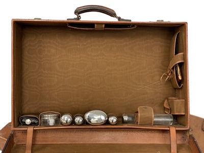 Lot 143 - A large leather suitcase.