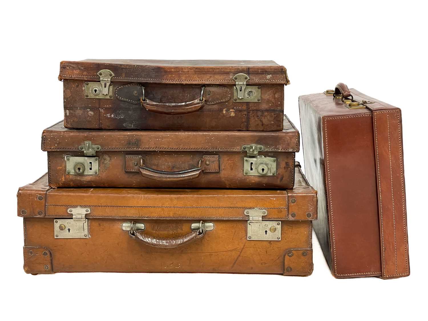 Lot 143 - A large leather suitcase.