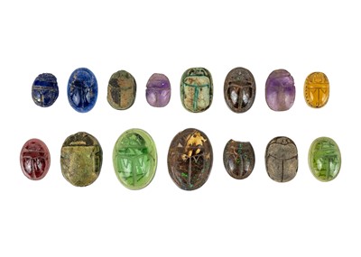 Lot 291 - A collection of carved faience and gemstone Egyptian scarab beetles.