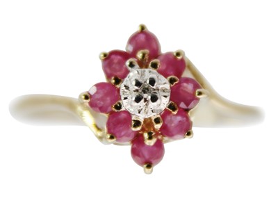 Lot 177 - A 9ct ruby and diamond cluster ring.