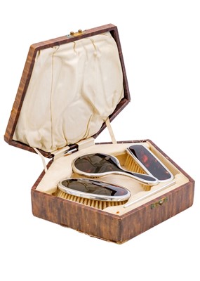 Lot 36 - A cased child's silver and tortoiseshell dressing set by Adie Brothers Ltd.