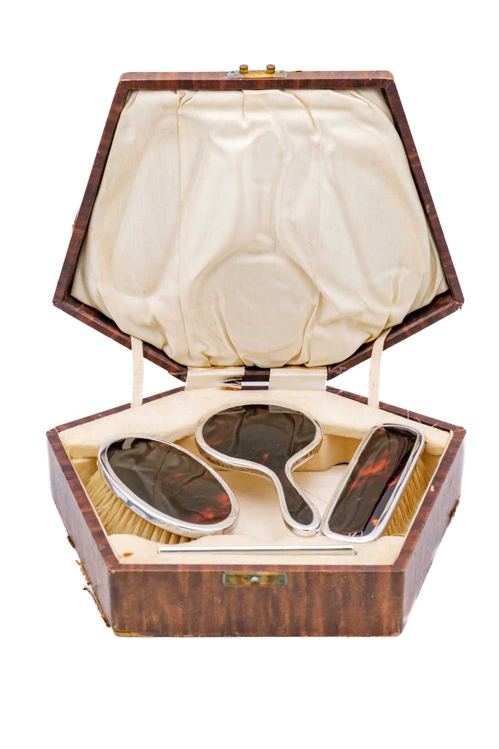 Lot 36 - A cased child's silver and tortoiseshell dressing set by Adie Brothers Ltd.