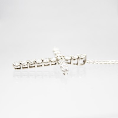 Lot 196 - A good 18ct white gold certified diamond set cross pendant necklace.
