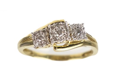 Lot 198 - A 9ct triple cluster diamond set ring.