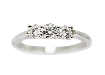 Lot 208 - An 18ct white gold certified diamond three-stone ring.