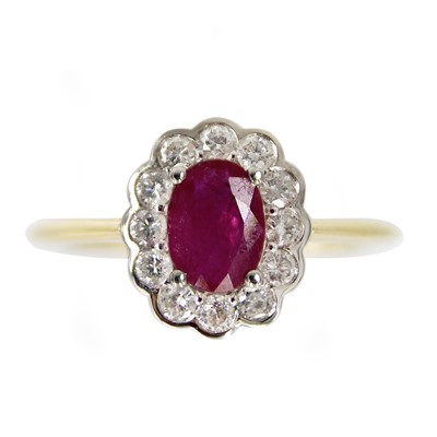Lot 230 - An 18ct white and yellow gold ruby and diamond cluster ring.