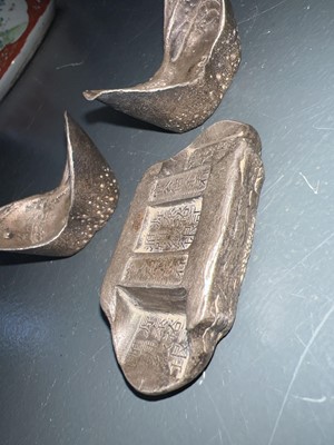 Lot 310 - Three Chinese silver ingots.