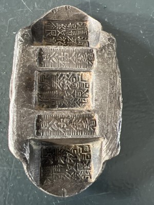 Lot 310 - Three Chinese silver ingots.