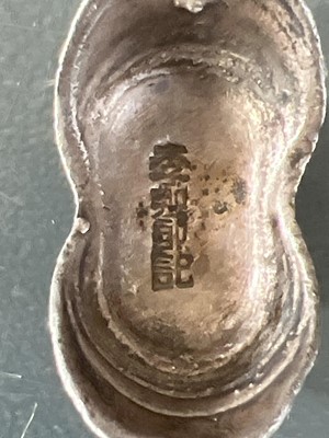 Lot 310 - Three Chinese silver ingots.