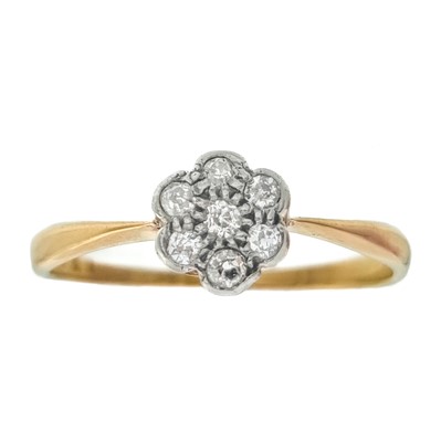 Lot 233 - An 18ct diamond set seven-stone daisy ring.