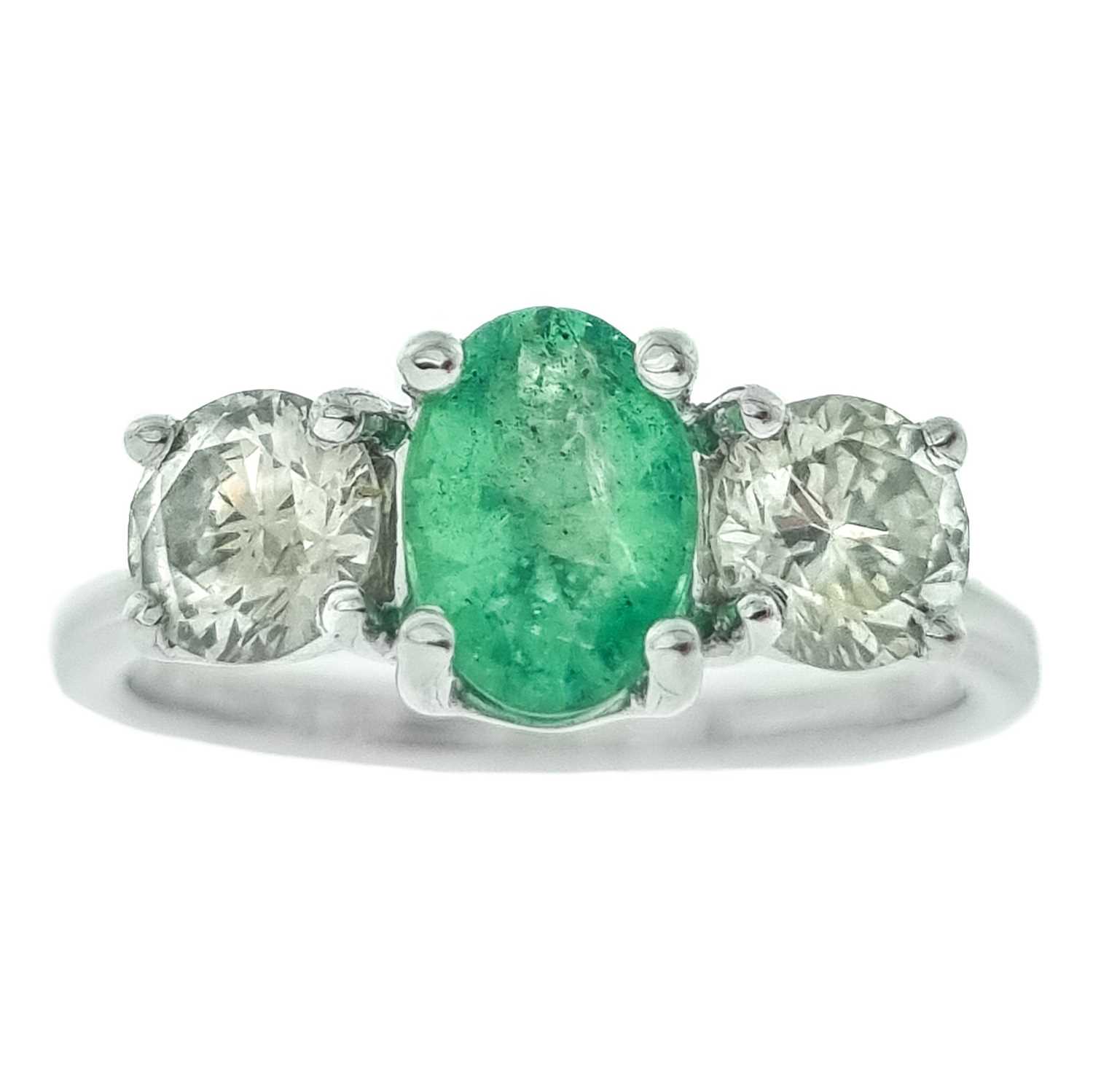 Lot 234 - A good 18ct white gold certified emerald and diamond three-stone ring.