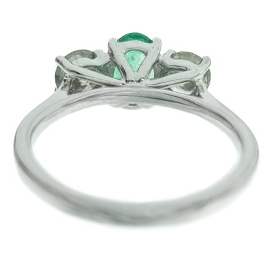 Lot 234 - A good 18ct white gold certified emerald and diamond three-stone ring.