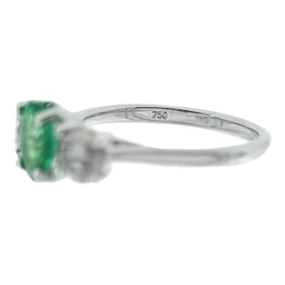 Lot 234 - A good 18ct white gold certified emerald and diamond three-stone ring.