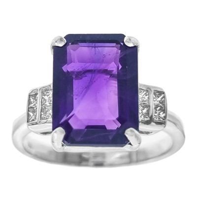 Lot 245 - An attractive 18ct white gold amethyst and diamond set three-stone ring.