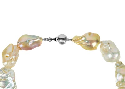 Lot 238 - An impressive string of large baroque pearl necklace with 9ct white gold ball clasp.
