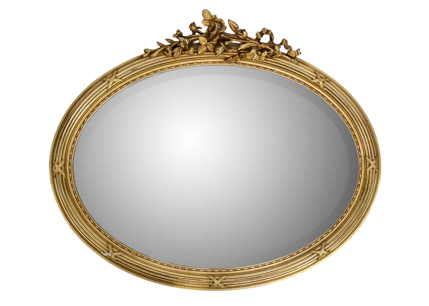 Lot 63 - A French oval gesso gilt mirror.