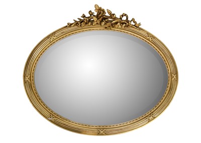 Lot 63 - A French oval gesso gilt mirror.