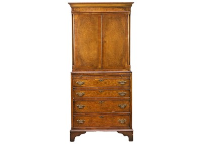 Lot 607 - An Edwardian burr walnut veneer cabinet .