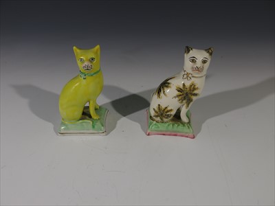 Lot 969 - Two Staffordshire type seated cat ornaments....