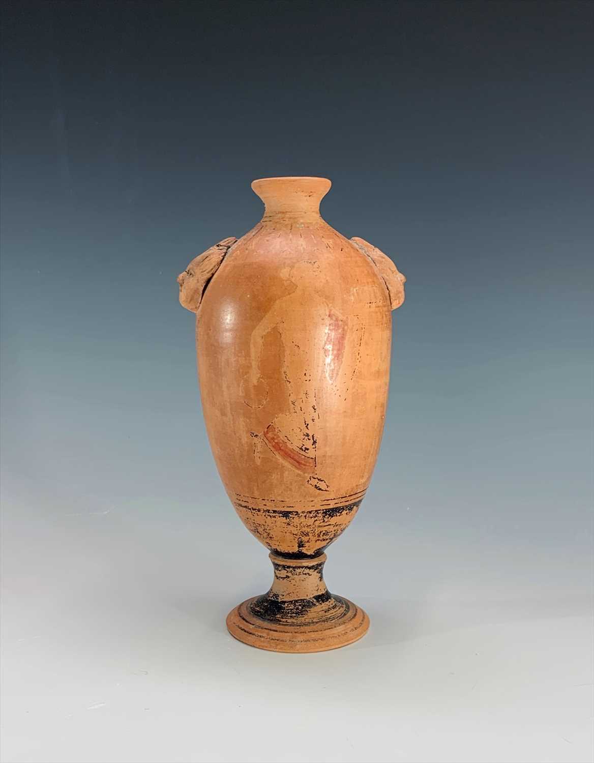 Lot 220 - A terracotta footed vase, probably Roman, with...