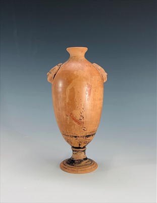 Lot 220 - A terracotta footed vase, probably Roman, with...