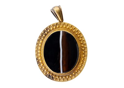 Lot 236 - A Victorian Etruscan Revival high-purity gold banded agate set locket pendant.