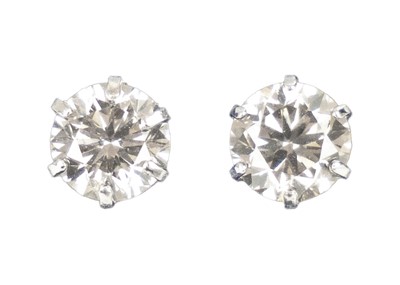 Lot 256 - A platinum pair of 0.60ct diamond solitaire ear studs.