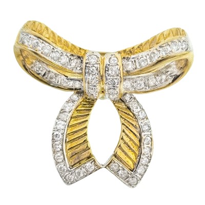 Lot 260 - A 14ct white and yellow gold diamond set slide pendant, in the form of a bow.