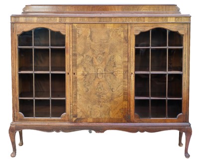 Lot 626 - An early 20th Century walnut display cabinet.