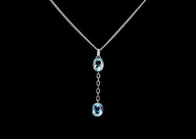 Lot 211 - An 18ct white gold blue topaz and diamond set pendant necklace.