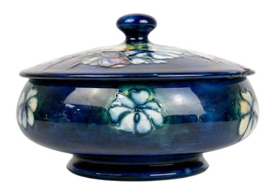 Lot 431 - A Moorcroft pottery orchid pattern circular box and cover.