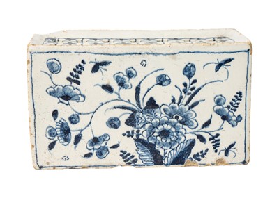 Lot 1101 - A Delft blue and white flower brick.