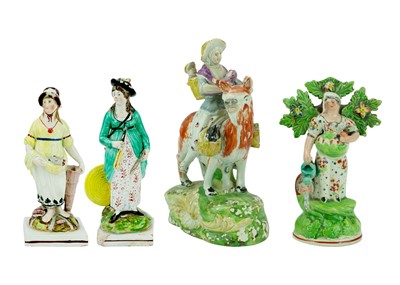 Lot 1289 - A collection of four early 19th century pearlware Staffordshire figures.