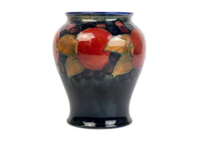 Lot 426 - A Moorcroft pomegranate pattern baluster vase.